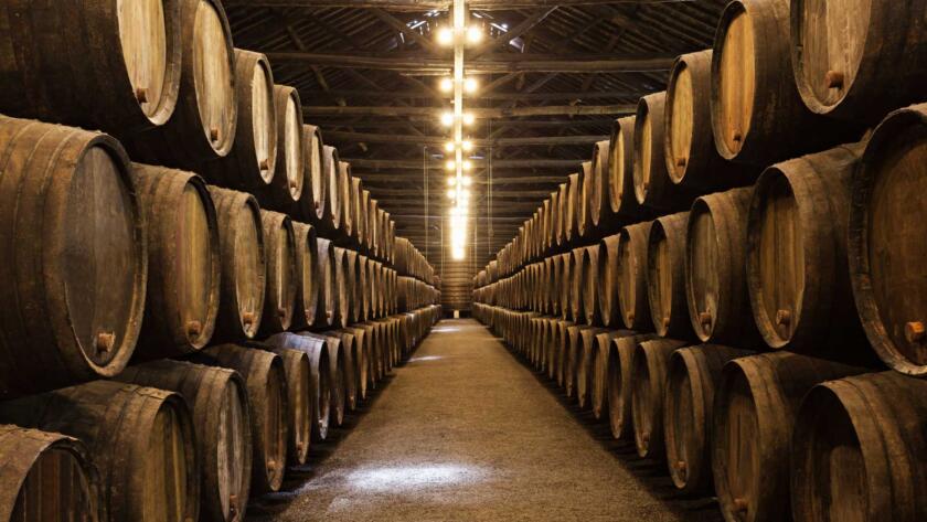 whisky casks stacked in warehouse representing new arrivals and storage